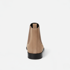 Back view of men's beige suede ankle boots showing elastic gussets and low block heel with pull-tab