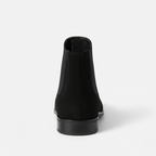 Back view of men's black suede ankle boots showing elastic gussets and low block heel with pull-tab