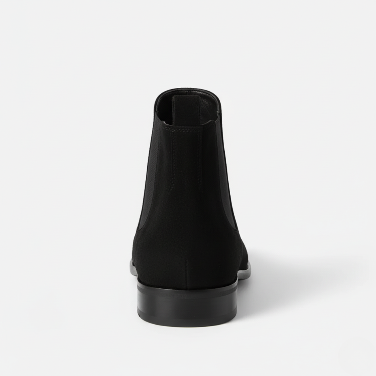 Back view of men's black suede ankle boots showing elastic gussets and low block heel with pull-tab