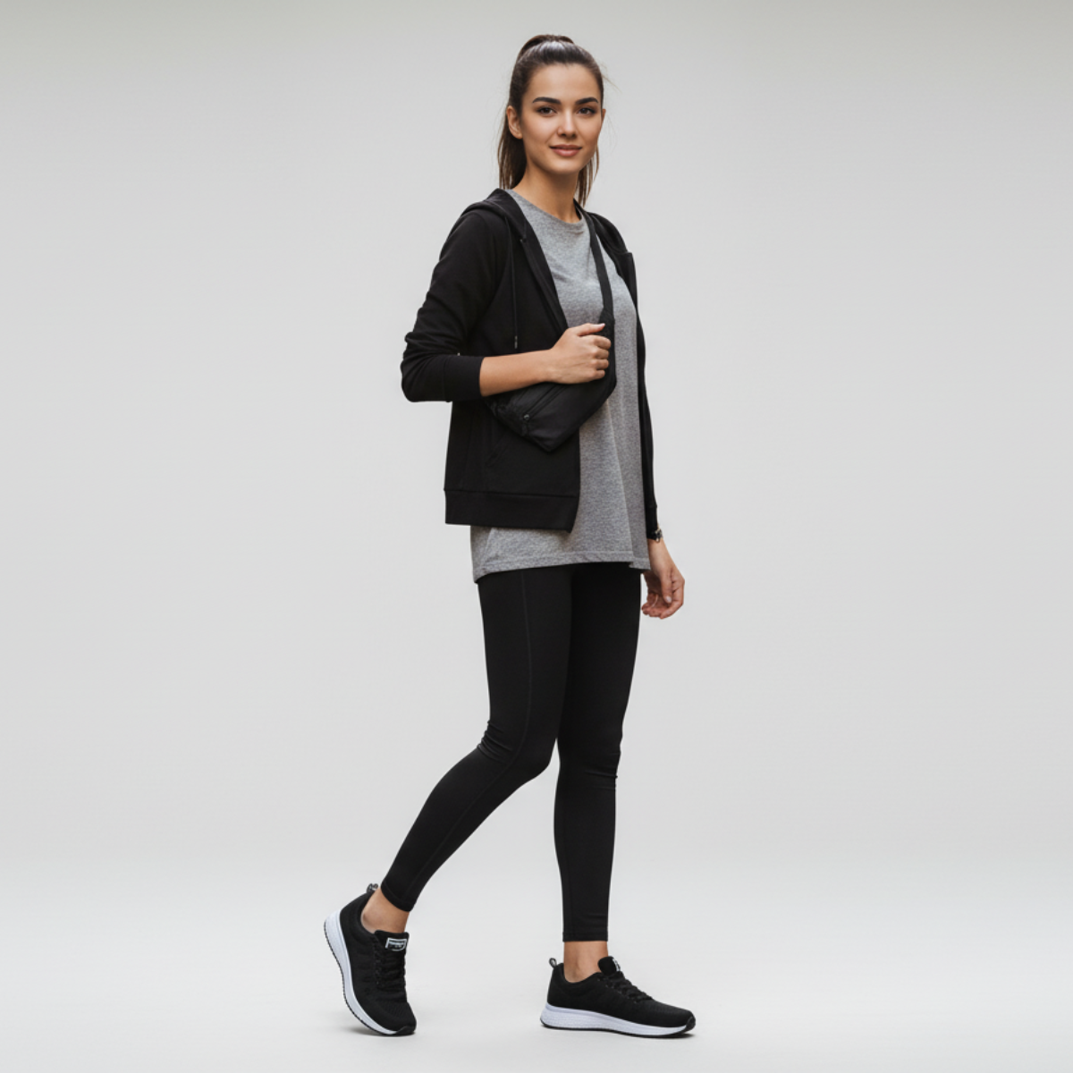 Black casual sneakers with white contrast white sole, full-body lifestyle shot on model wearing black and outfit on white background