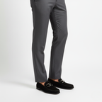 Black suede dress loafers for men worn with tailored trousers for smart business casual style