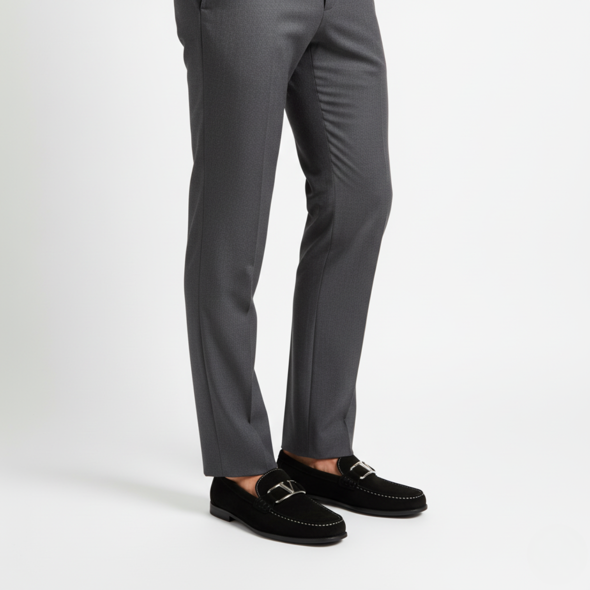 Black suede dress loafers for men worn with tailored trousers for smart business casual style