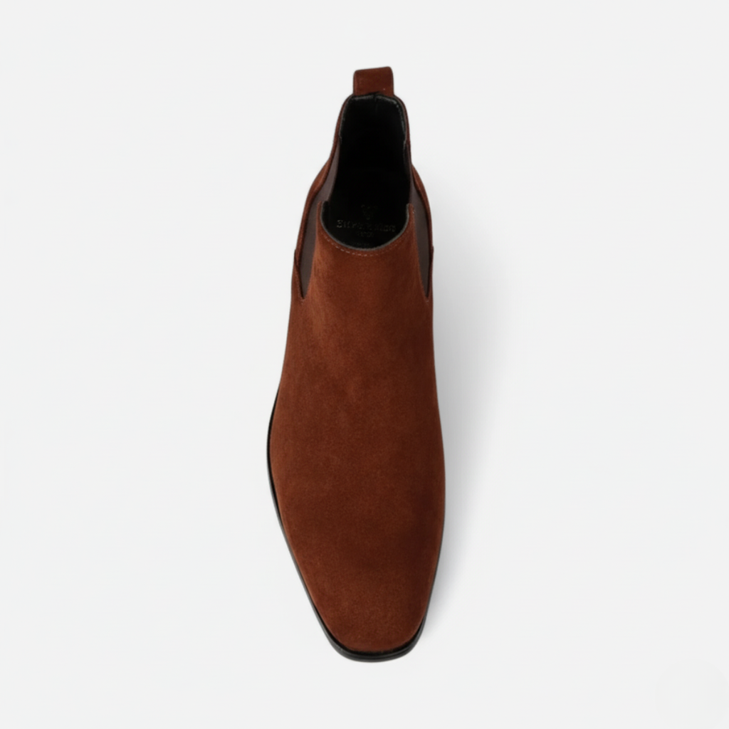 Top view of men's brown suede Chelsea boots featuring square toe shape and convenient pull-tab