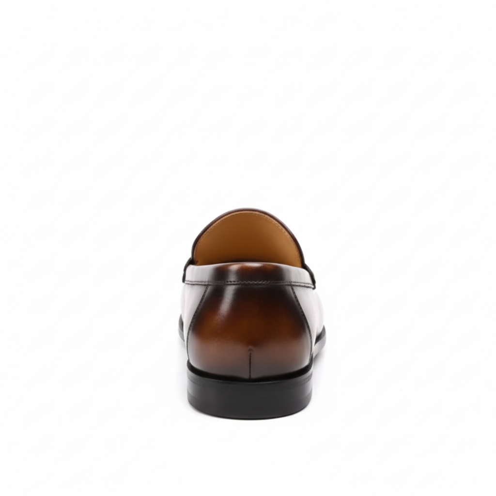 Back view of brown men's slip-on dress loafers with premium leather construction and low heel