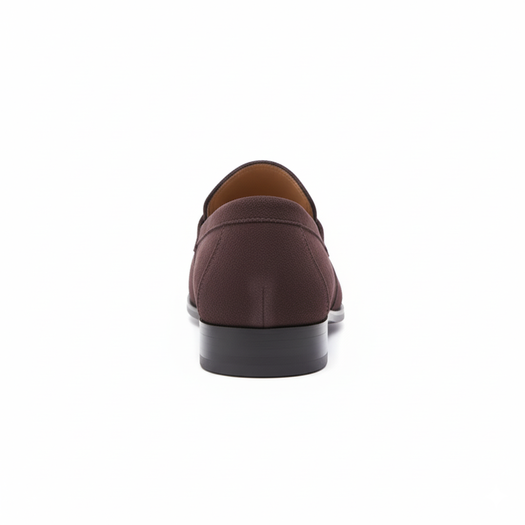 Back view of brown suede penny loafers displaying structured heel counter and quality stitching
