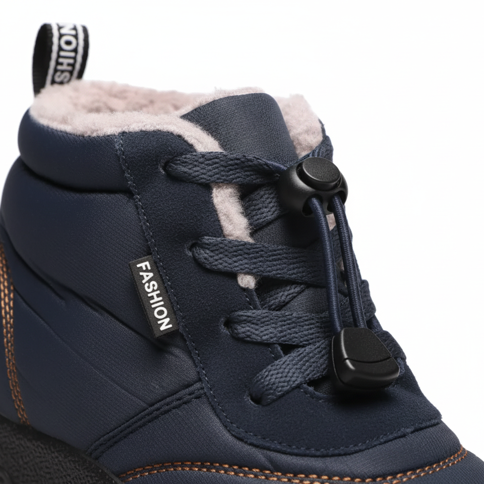 Close-up detail of navy barefoot boot showing quick-lace toggle system and plush fleece lining