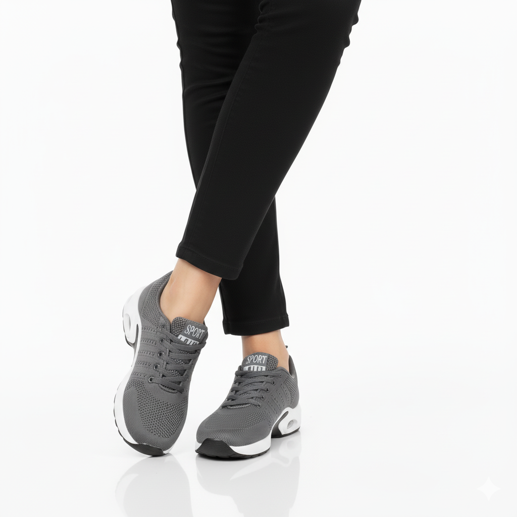 Grey breathable mesh sneakers with air cushion sole and arch support styled with black trousers - Lewis Fordham UK