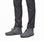 Grey insulated barefoot boots styled with dark trousers for casual winter look