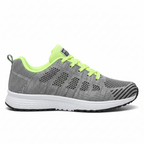 Grey women's athletic shoes with neon yellow accents and breathable mesh upper for running and gym