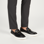 Black platform loafers with croc texture styled with charcoal trousers for modern smart-casual look