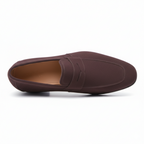 Top view of men's brown suede penny loafers showing classic keeper strap and leather footbed