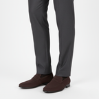 Brown suede penny loafers for men styled with charcoal dress trousers for professional look