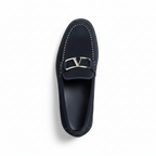 Top view of men's navy suede loafers showing decorative metal hardware and contrast stitching detail