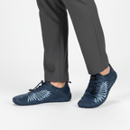 Navy barefoot aqua shoes worn showing flexible design and natural toe movement for water sports and beach walking