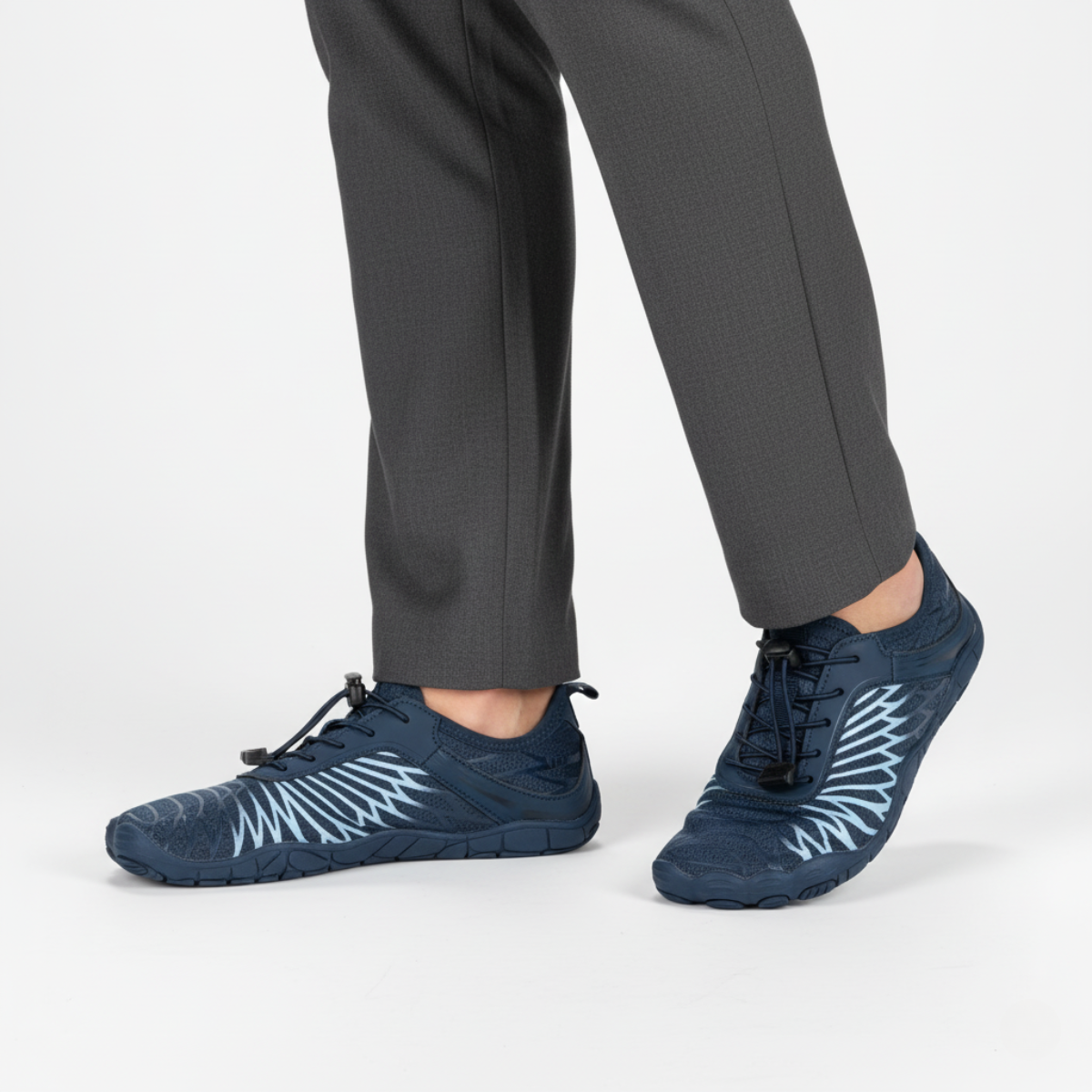 Navy barefoot aqua shoes worn showing flexible design and natural toe movement for water sports and beach walking