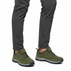 Olive green outdoor hiking shoes with mesh panels and rugged sole styled with grey trousers - Lewis Fordham UK