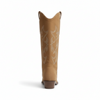 Back view of tan Western knee-high boots displaying stacked Cuban heel and decorative stitching