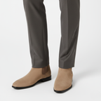 Taupe suede Chelsea ankle boots for men worn showing square toe design and classic pull-on style