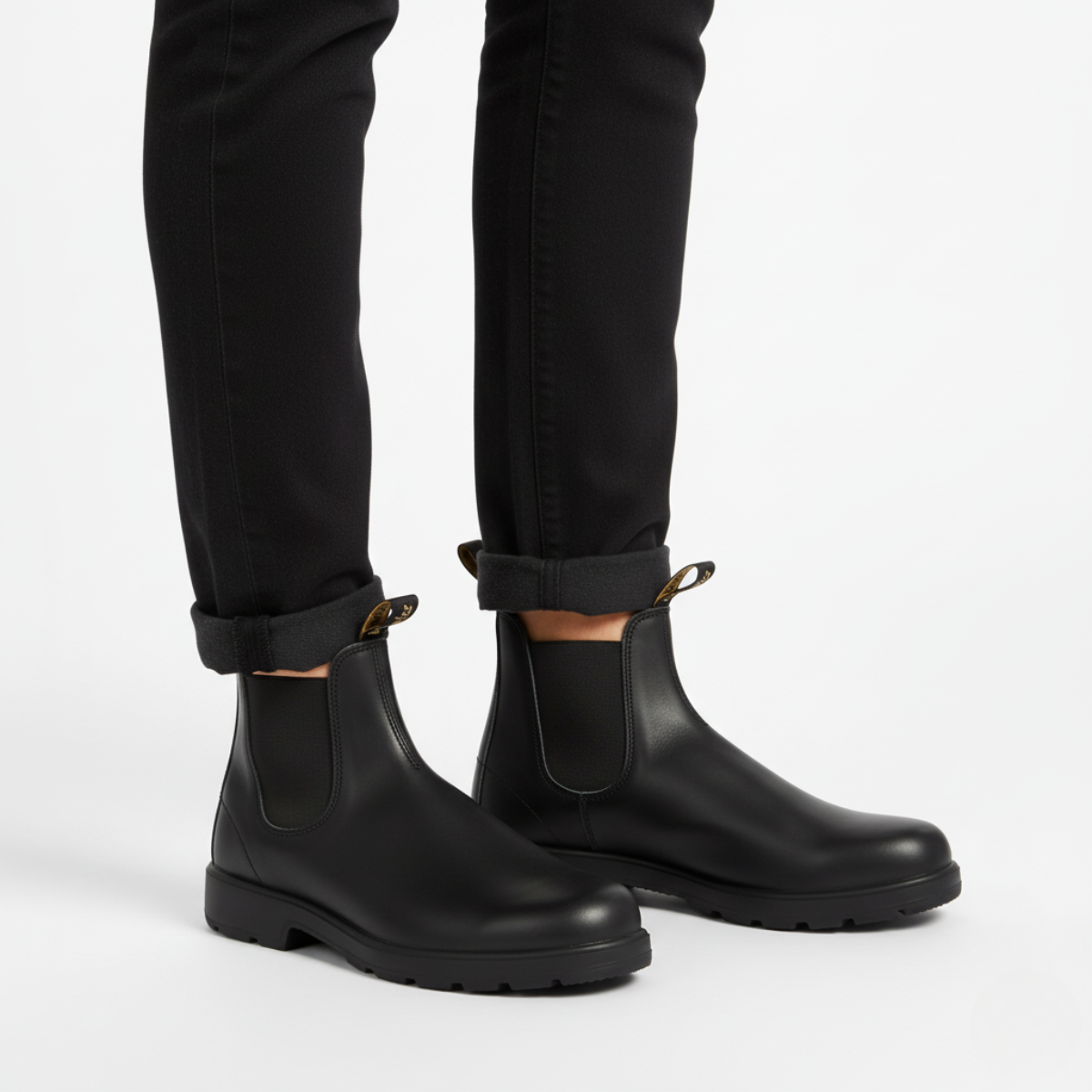 Chelsea boots unisex styled with rolled jeans showing versatile casual wear